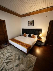 a bedroom with a large bed in a room at Hotel Nubra Delight and Camps in Hundar