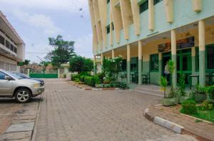 a car parked in front of a building at Hotel JB&G in Cotonou +16 photos