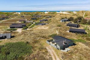 an aerial view of a group of houses on a hill at 5514-Hvide-Sande-Riskrogvej-18-C in Havrvig