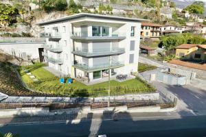 an aerial view of a large white building at Condominio Modern House in Menaggio