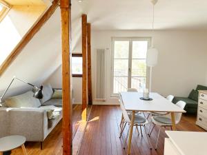 a living room with a couch and a table at Haus Münsterblick in Reichenau