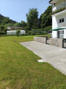 a walkway in front of a house with a yard at Apartamentos Arredondo in Arredondo