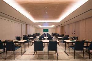 an empty room with tables and chairs and a classroom at Áurea Palacio de la Tinta by Eurostars Hotel Company in Málaga +114 photos