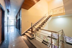 a winding staircase in a building with a stair railing at Hotel Neel Kamal-Near KhatuShyamJi Temple in Khātu +34 photos