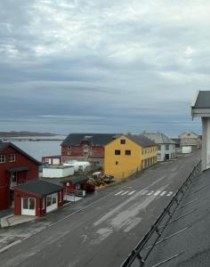 a town with houses and a street with a road at Rooftop view apartment 2 in Vardø