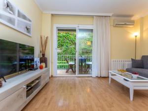 a living room with a couch and a table at Apartment Buenos Aires by Interhome in Lloret de Mar