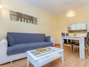 a living room with a couch and a table at Apartment Buenos Aires by Interhome in Lloret de Mar +20 photos