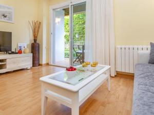a living room with a white coffee table at Apartment Buenos Aires by Interhome in Lloret de Mar