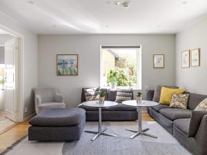 a living room with a couch and a table and chairs at Villa Villa Anja by Interhome in Asarum