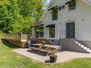a patio with a picnic table in front of a house at Villa Villa Anja by Interhome in Asarum