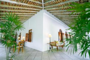 a room with plants and a ceiling at Adigars Manor Kandy - A Boutique Heritage Hotel Built in 1804 in Kandy