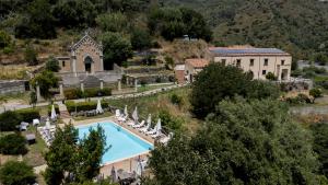 an aerial view of a villa with a swimming pool at La Locanda degli Amici in Santa Teresa di Riva