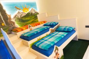 Postel nebo postele na pokoji v ubytování Hotel Touring
