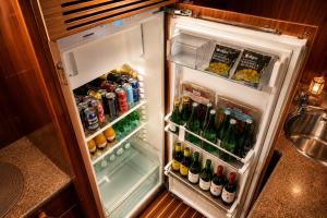 an open refrigerator filled with lots of drinks at Captain Cangrejo Yacht in Cádiz