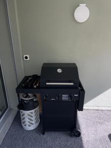a black printer sitting on the floor in a room at Spacious 2 bedroom apartment in Engelberg