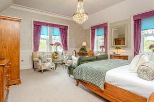 a bedroom with a bed and a living room at Muckrach Country House in Skye of Curr