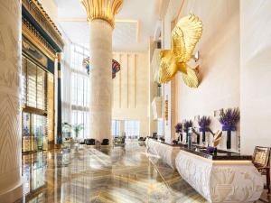 a lobby with a large hall with a bird on the ceiling at Sofitel Dubai The Obelisk in Dubai +288 photos
