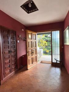 an empty room with a door and an open doorway at Villa Karina in Valdemanco +50 photos