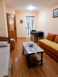 a living room with a couch and a table at Native Apartments in Budva