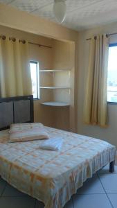 Ένα ή περισσότερα κρεβάτια σε δωμάτιο στο Pousada Portal da Ilha