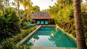 an image of a swimming pool in a villa at The Woods Uluwatu in Uluwatu