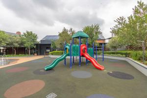 a playground with a slide in a park at EdenNest in Boksburg