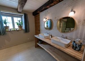 a bathroom with two sinks and a mirror at Gite L étable du Bien Etre in Ray-sur-Saône +43 photos