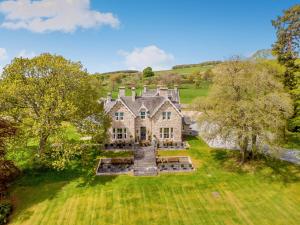 an aerial view of a large house in a field at Muckrach Country House in Skye of Curr