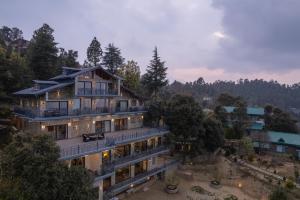 an aerial view of a house in the mountains at Dharohar Retreat, Mukteshwar in Mukteshwar