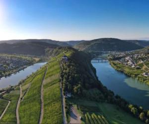 an aerial view of a river and a city at Moselmoni in Bullay
