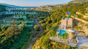 an aerial view of a hot air balloon and a resort at Villa Rubin in Almyrida