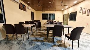 a conference room with a table and chairs at Appa Hillside Nature Resort in Karjat