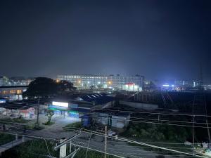 a city at night with buildings and train tracks at Abc HOTEL & LODGE in Biratnagar
