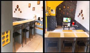 a kitchen with a counter and a bar with chairs at Loft LE ROOF in Bahus-Soubiran