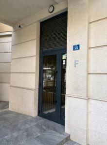 a door of a building with a f sign on it at Green Hills by MI in Podgorica
