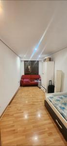 a room with a couch and a bed in it at Torrent in Torrent