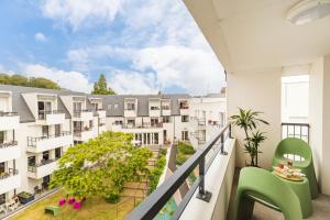 an apartment balcony with a view of a building at Résidence de Perros-Guirec in Perros-Guirec