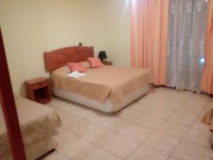 Postelja oz. postelje v sobi nastanitve Hotel La Casona