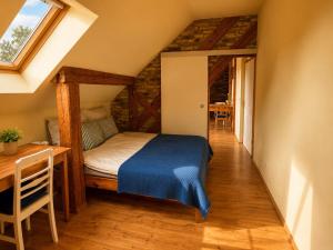 a bedroom with a bed and a table in a room at Pauline 3 in Templin