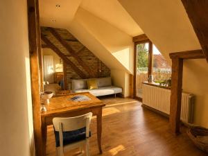 a living room with a table and a couch at Pauline 3 in Templin