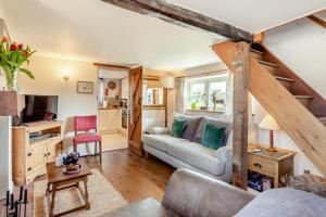 a living room with a couch and a table at 2 Bed in Bodham oc-2082 in Bodham