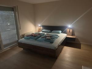 a bedroom with a bed with two towels on it at Stay Zentral Dresden in Dresden