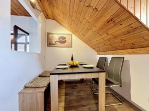 a dining room with a table and chairs at Apartment Sirch-3 by Interhome in Diedorf +18 photos