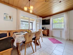 a kitchen and dining room with a table and chairs at Apartment Sirch-4 by Interhome in Diedorf