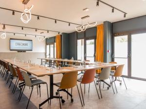 a large conference room with a long table and chairs at Tribe Carcassonne in Carcassonne +220 photos