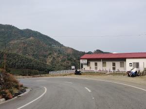 a house on the side of a road at Deodar Abode in Lohaghāt