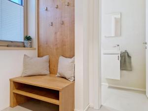 a room with a bench with two pillows on it at Apartment A3 by Interhome in Kematen in Tirol +42 photos