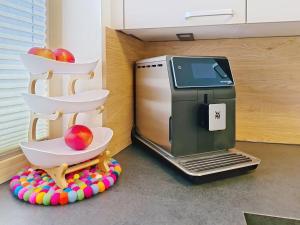 a toy kitchen with a toaster and apples on a table at Apartment A3 by Interhome in Kematen in Tirol
