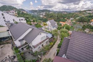 an aerial view of a city with houses and buildings at Mộc in Ấp Ða Lợi