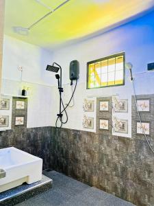 a bathroom with a shower and a sink at Hill Top Villa Kandy in Ambatenna +29 photos
